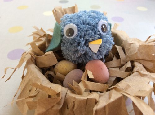 Craft Tutorial: Pom Pom Bird in a brown paper nest