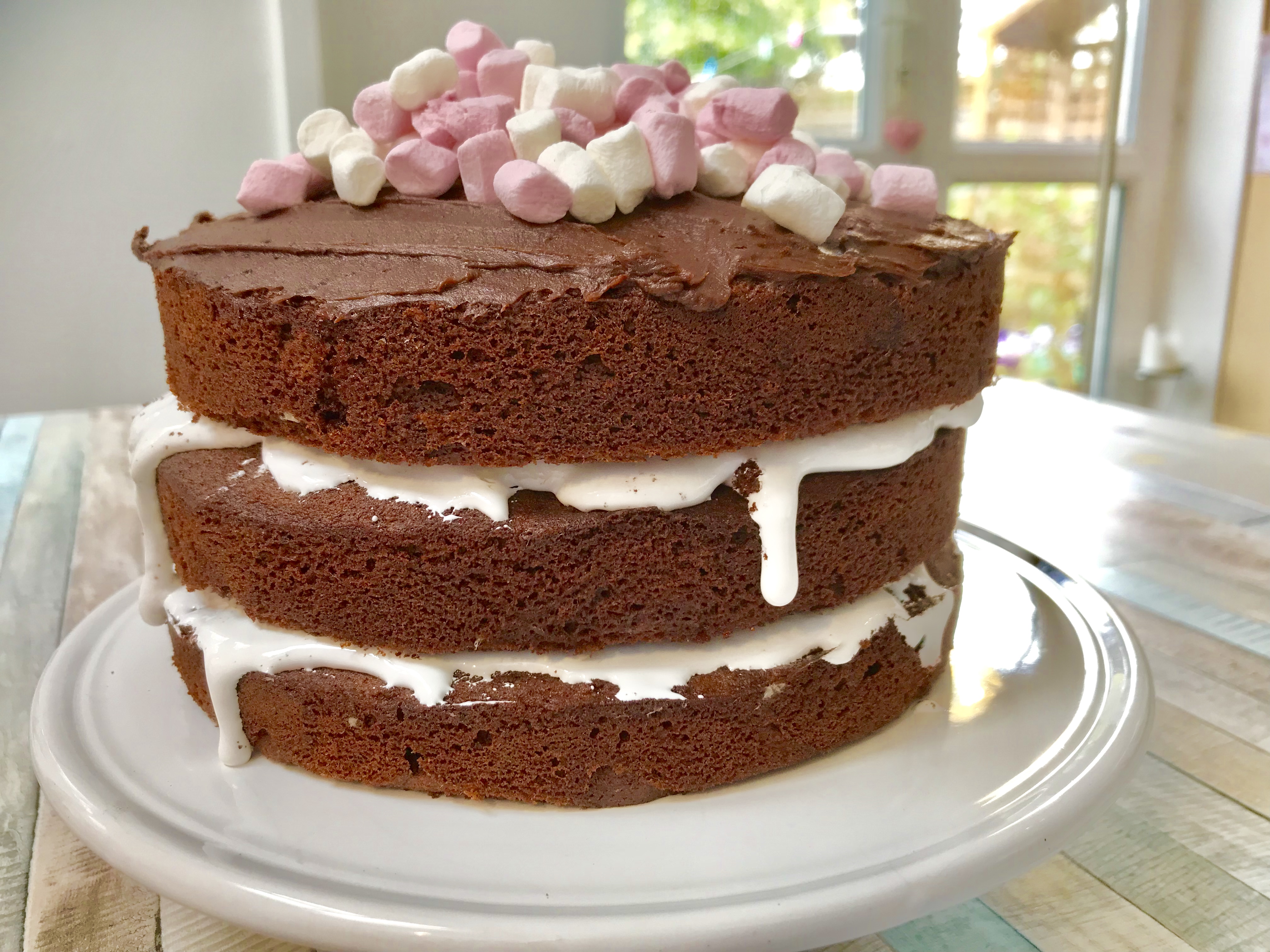 Delicious cake with marshmallows on white background Stock Photo - Alamy